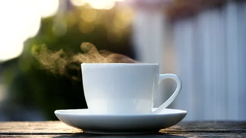 Close-up steaming hot coffee or tea cup, slow motion.Hot Coffee Drink Concept Stock Footage 143157758