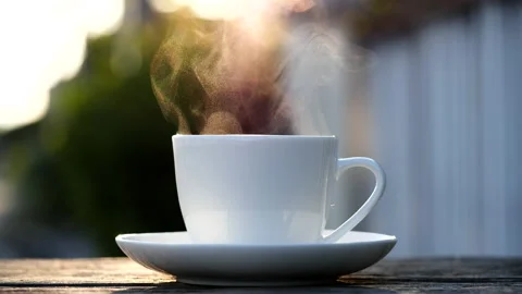 Close-up steaming hot coffee or tea cup, slow motion.Hot Coffee Drink Concept Stock Footage 143158037