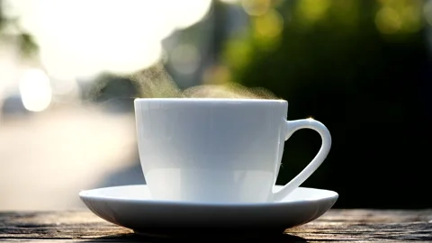 Close-up steaming hot coffee or tea cup, slow motion.Hot Coffee Drink Concept Stock Footage 143158297