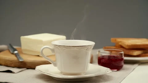 Close-up steaming hot coffee or tea cup Stock Footage 147560145