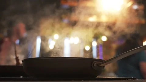 Close up steaming in kitchen. Steam or vapour clouds rising from the frying pan 스톡 동영상 263343064