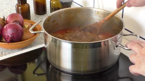 Close-up steaming meat cubes for a goulash dish in pot Stock Footage 48419608
