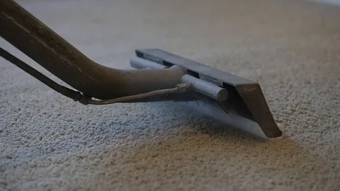 Close up on steaming tool going back and forth on tan carpet spot cleaning 스톡 동영상 85868315