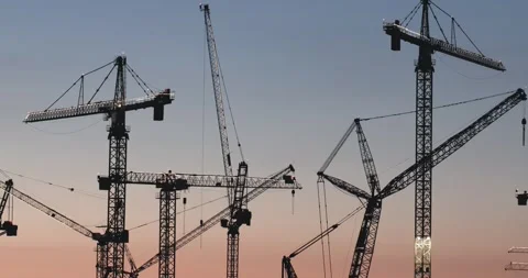 Close up steel structure tower cranes at industrial construction site Stockbeeldmateriaal 336429271