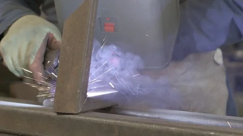 Close-up of a steel worker welding Stock Footage 74760631