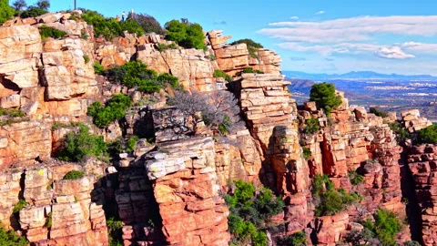 Close up of steep red sandstone cliffs with valley view Stock Footage 334858415