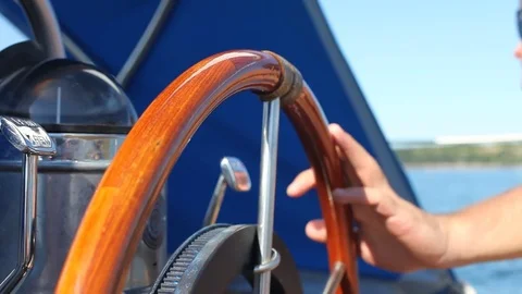 Close up of steering a boat wheel Stock Footage 83462578