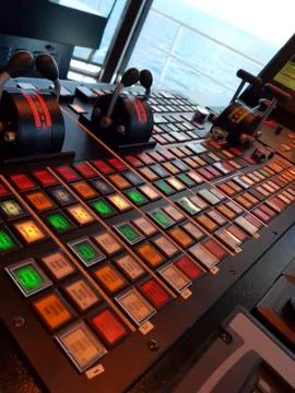 Close up on steering controls and control panels in wheelhouse in modern ship Stock Photos