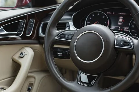 Close up of steering wheel. Car dashboard. Stock Photos