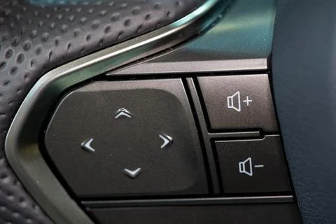 Close up of steering wheel control buttons in modern car Stock Photos