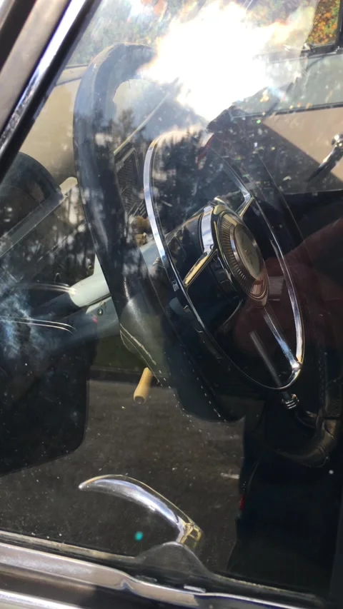 Close-up of the steering wheel of a stylish, beautiful retro car. Stock Footage 321354904