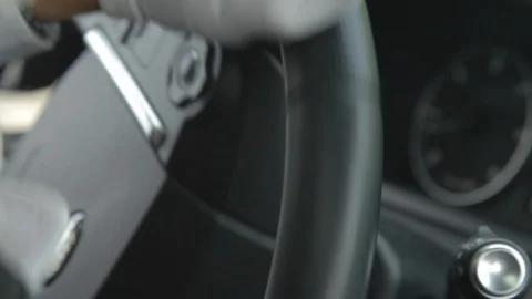 Close up of a steering wheel turned by Luxury handsome caucasian taxi car driver Stock-Footage 110770440