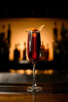 Close-up of stemware of red alcoholic drink on bar counter. 스톡 사진