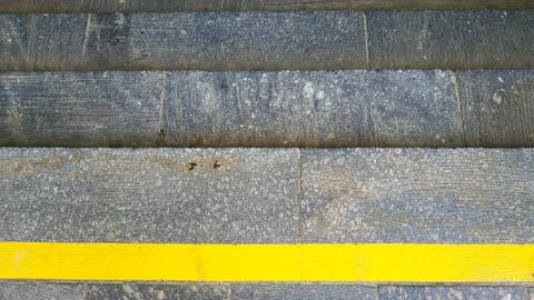 Close-up steps with a bright yellow protective line Stock-Fotos