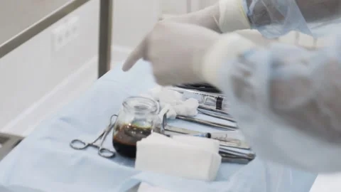 Close up of sterile surgical tools for laparoscopic surgery. Action. Tools for Stock Footage 140845743