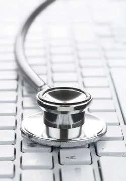 Close up of stethoscope on the computer keyboard with copy space Stock Photos