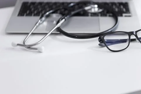 Close-up stethoscope on laptop with copy space. Stock Photos