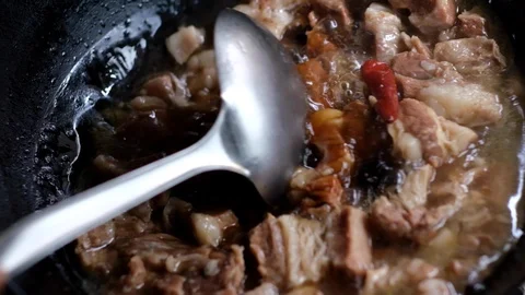 Close up of stewing beef in pot in Chinese cooking style, slow motion 120FPS Stock Footage 114644335