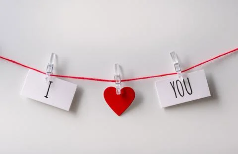 A close up of a sticky note with the word I Love You with red heart Stock Photos