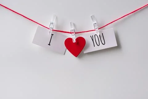 A close up of a sticky note with the word I Love You with red heart Stock Photos