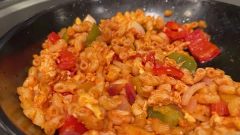 Close-up of stir-fried macaroni with vegetables and protein Stock Footage 312094841