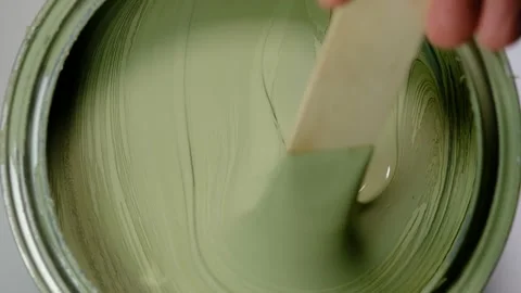 Close up of stirring a gallon of paint Stock Footage 138956468