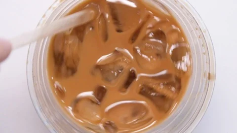 Close Up Stirring Ice Coffee Stock Footage 100650381