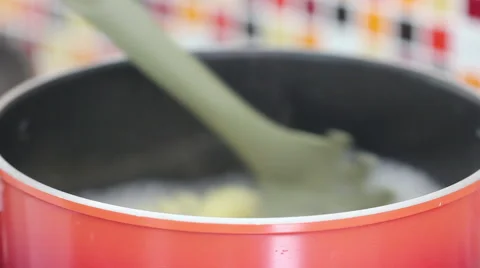 Close Up Stirring Macaroni Spoon In Boiling Pot And Showing Ripe Macaroni Video stock 65817812