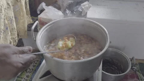 Close Up Stirring Vegetable Soup with Steam Traditional Cooking Indonesia Stock Footage 332482847