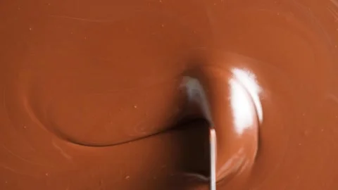 Close up of stirring warm liquid chocolate texture top view Stock Footage 344872391