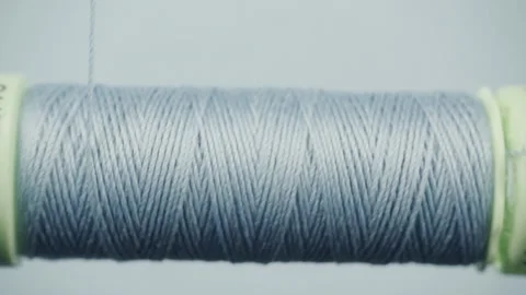 Close up of stitching thread and stitching roll in slow motion, sewing machine Stock Footage 135874098