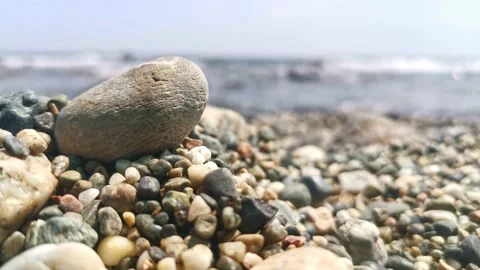 Close Up of Stone at Beach with Waves on Background Stock Footage 144608524