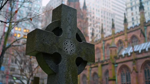 Close up of stone celtic cross headstone in cemetery. Detailed view of an Stock Footage 328968893