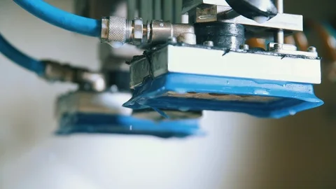 Close up of stone grind machine dripping in ski tuning shop Stock Footage 94193675