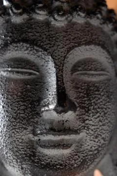 Close up on stone head of Buddha Stock Photos