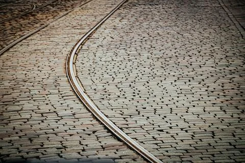 Close-up of stone pavement with embedded tram. Фото