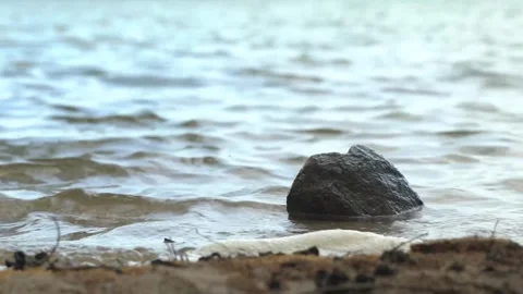 Close up stone at shore Stockbeeldmateriaal 266657648