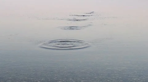 Close-up of stone skipping on water surface Stock Footage 48360225