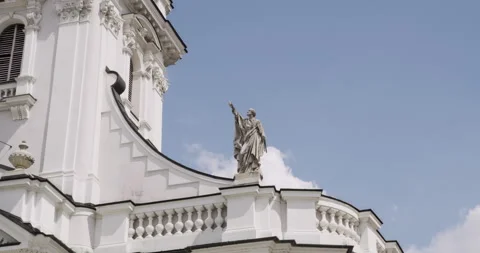 Close-up of stone statue on the facade of a historic baroque-style basilica. Stock Footage 313834148