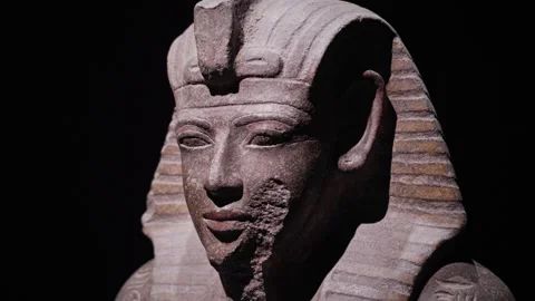 Close-up of a stone statue of Pharaoh Ramses II, highlighting detailed facial Stock Footage 333445275