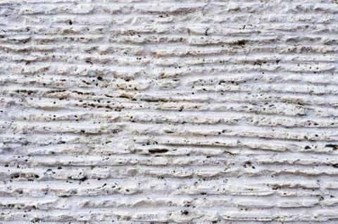 Close-up of stone surface with traces of processing. Parallel lines on the stone Stock Photos