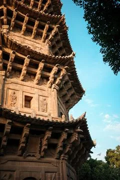 Close-up of the stone tower brackets and figure reliefs at Kaiyuan Temple i.. Stock Photos