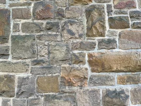 Close Up Stone Wall Texture with big bricks on ancient historic church in Stock Photos