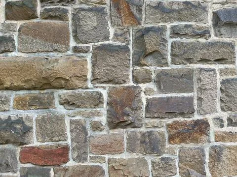 Close Up Stone Wall Texture with big bricks on ancient historic church in Stock Photos