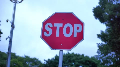 Close-Up of a 'Stop' Traffic Sign on the Road Stock Footage 300146748