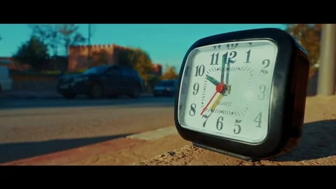 Close up of stopped clock with busy city life bokeh background Stock Footage 342454364