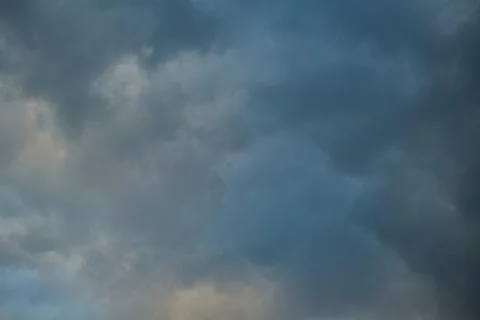 A close-up of a storm cloud, overcast sky, dramatic sky before the rain, shad Stock Photos