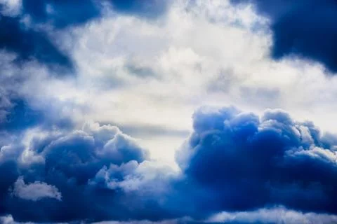 Close-up of stormy blue clouds in the sky, textured clouds on a blue sky. Stock Photos