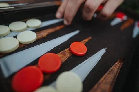 Close-up of strategic backgammon game with red and white pieces Stock Photos
