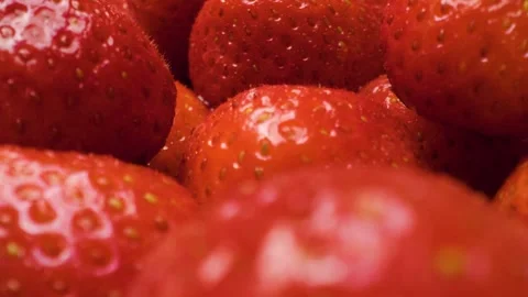 Close-up of strawberries captured with a sliding motion. 스톡 동영상 313802361